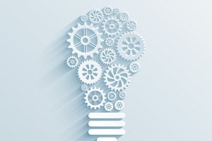 vector paper light bulb with gears and cogs, business interaction concept